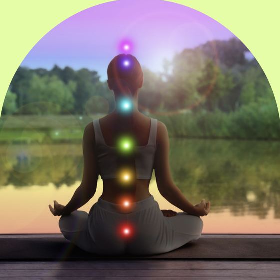 A meditating figure with glowing chakra points along the spine